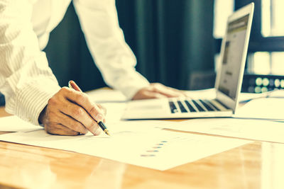 Close-up of man working on table