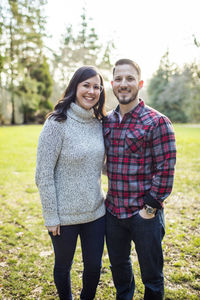 Attractive young couple posing outdoors.