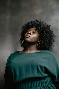 Portrait of young poc woman looking at camera