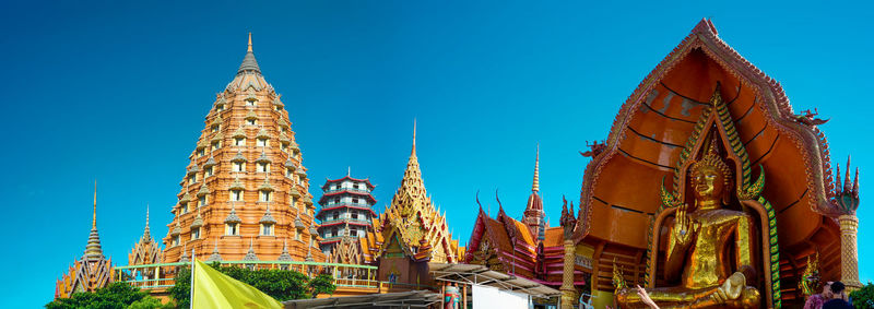 Low angle view of buildings against blue sky