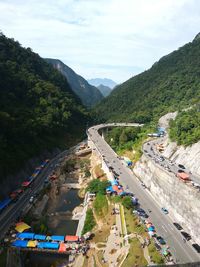 High angle view of road amidst mountains against sky