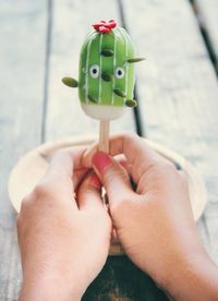 Close-up of woman holding hand