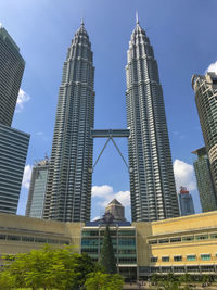 Low angle view of buildings in city against sky