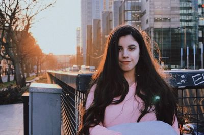 Portrait of beautiful woman in city