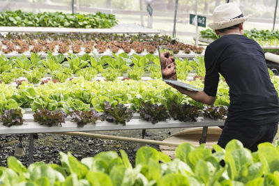 Female researchers examine vegetables for capsule filling.