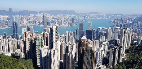 High angle view of modern buildings in city against sky