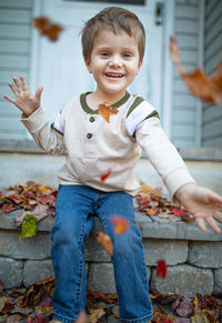 Portrait of cute boy smiling outdoors