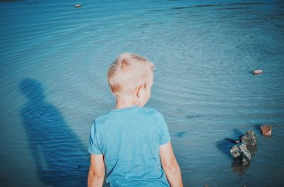 High angle view of boy in sea