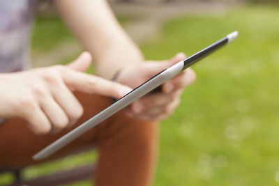 Close-up of hand holding mobile phone