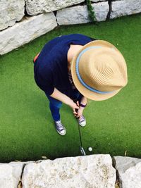 High angle view of woman playing golf