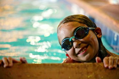 Portrait of happy boy swimming in pool