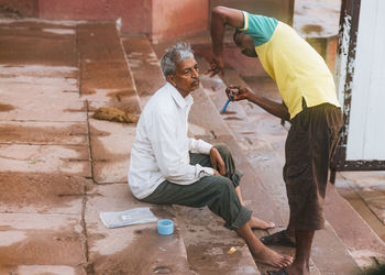 Side view of people working