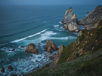 Dramatic landscape view of ocean coastline nature park breathtaking cliffs sandbanks water waves 