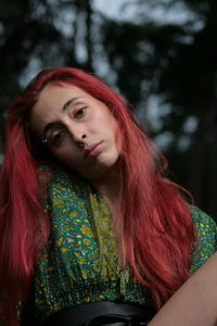 Portrait of young woman with red hair 