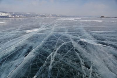 Aerial view of frozen sea against sky