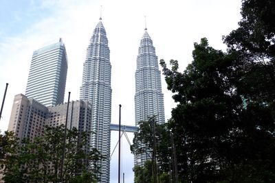 Low angle view of skyscrapers against sky