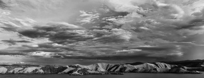 Scenic view of land against sky during winter