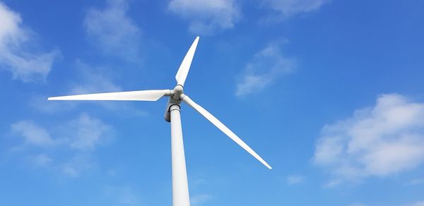 Low angle view of wind turbine against sky