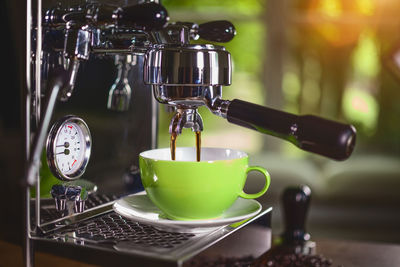 Close-up of espresso maker at cafe