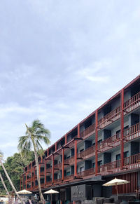 Low angle view of building against cloudy sky