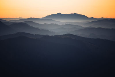 Scenic view of mountains against sky during sunset