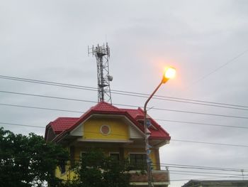 Low angle view of power lines against sky