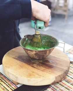 High angle view of person preparing food on table