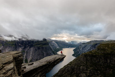 Scenic view of mountains and river against sky