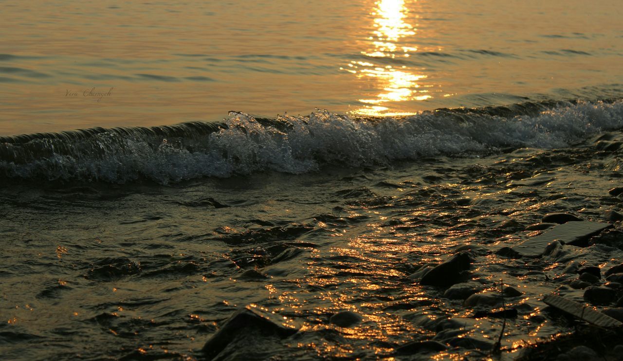 water, sunset, sea, wave, scenics, beach, motion, reflection, tranquility, nature, orange color, tranquil scene, beauty in nature, majestic, travel destinations, power in nature, vacations, tourism, non-urban scene, shore, outdoors, tide, seascape, splashing