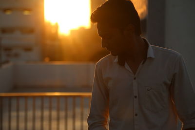 Young man looking away outdoors