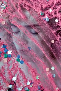 Sequin and pink powder paint on photograph of woman