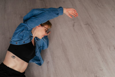 High angle view of young woman standing at home