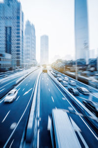 Blurred motion of modern buildings in city