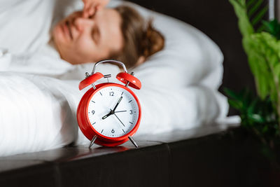 Close-up of a woman sleeping on bed