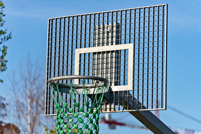 Low angle view of basketball hoop against sky