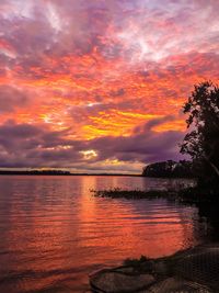 Scenic view of sea against orange sky