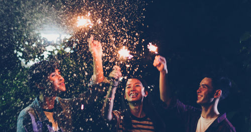 Group of people enjoying at night