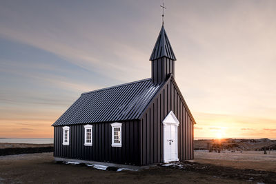 Built structure against sky during sunset