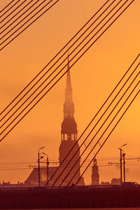 A beautiful cityscape of riga, latvia during sunrise. church towers against colorful sky. 