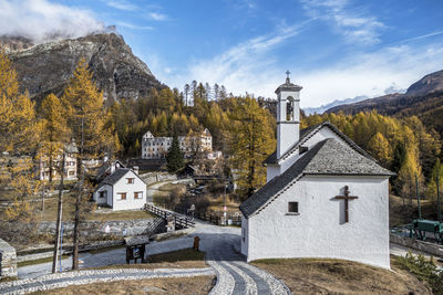 Panoramic view of trees and buildings against sky