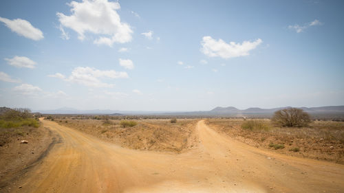 Dirt road passing through a desert