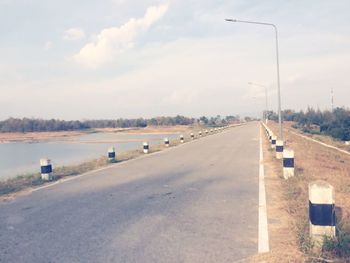 Empty road passing through landscape