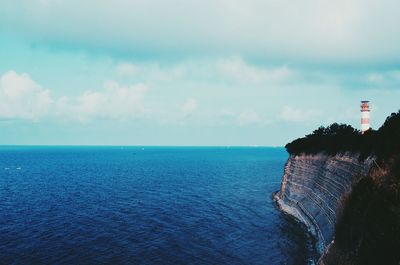 Scenic view of sea against cloudy sky