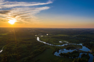 Beautiful orange sunset over the teza river in the ivanovo region, photo taken from a drone.