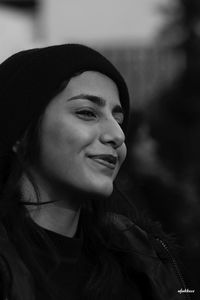 Close-up portrait of a smiling young woman