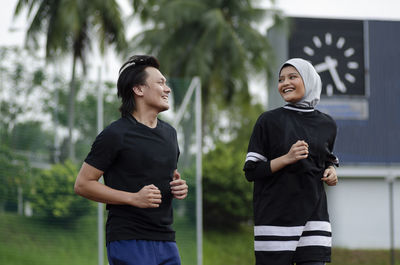 Full length of a smiling young couple