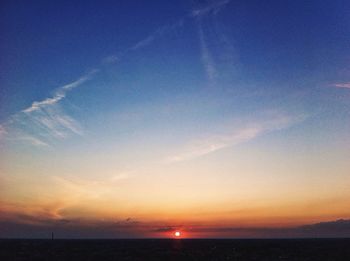 Scenic view of sea against sky at sunset