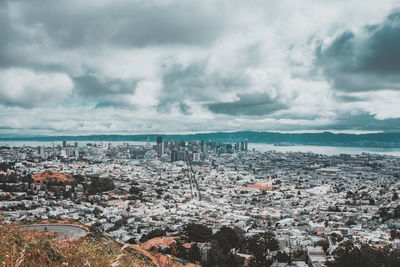 High angle view of city against cloudy sky