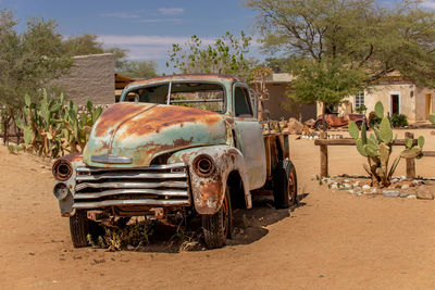 Abandoned car on road, solitaire