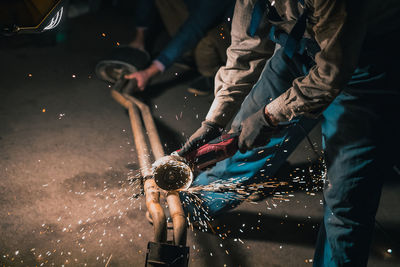 People working on street in city at night